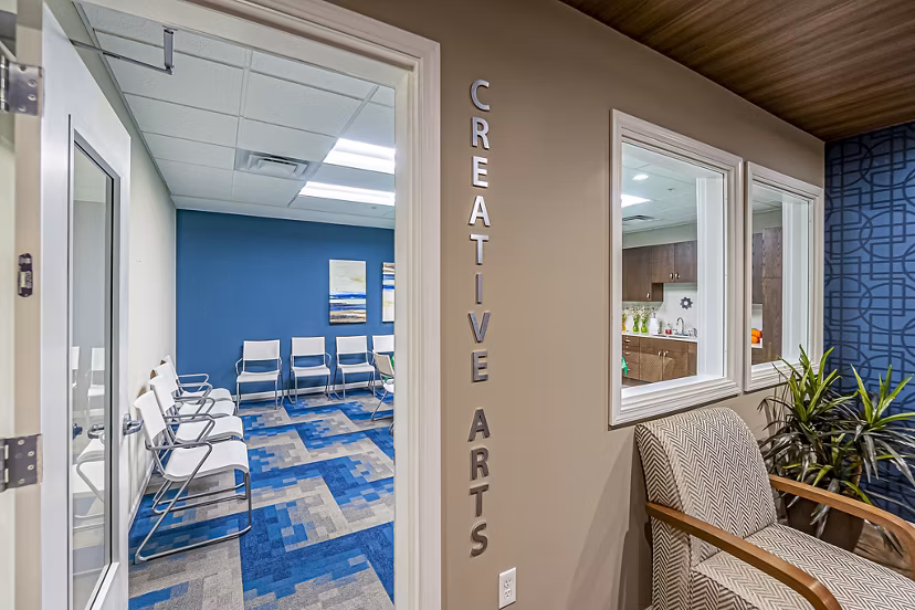 Creative arts area featuring art stations at Album Quail Springs Apartments, fostering artistic expression in a vibrant community space