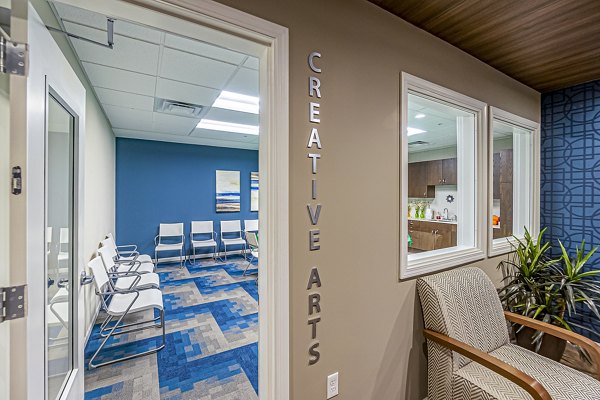 Creative arts area featuring art stations at Album Quail Springs Apartments, fostering artistic expression in a vibrant community space