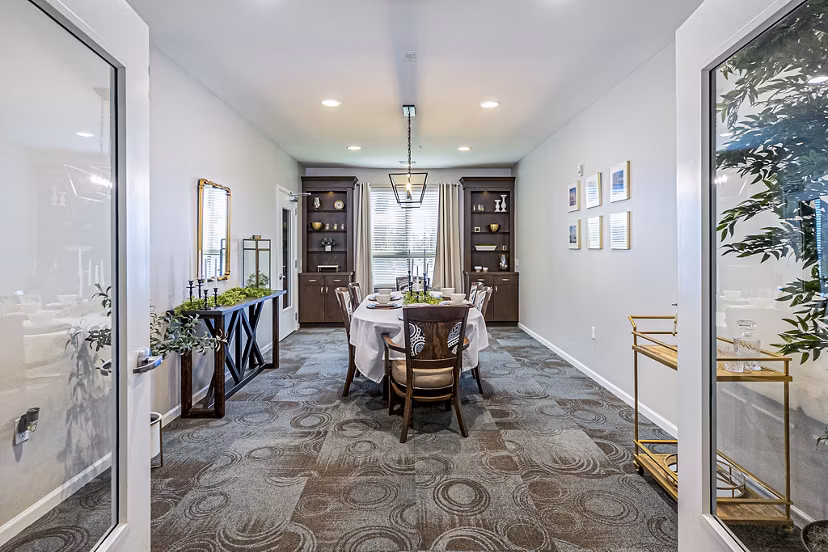 Community dining room with modern furnishings at Album Quail Springs Apartments, perfect for social gatherings and resident events