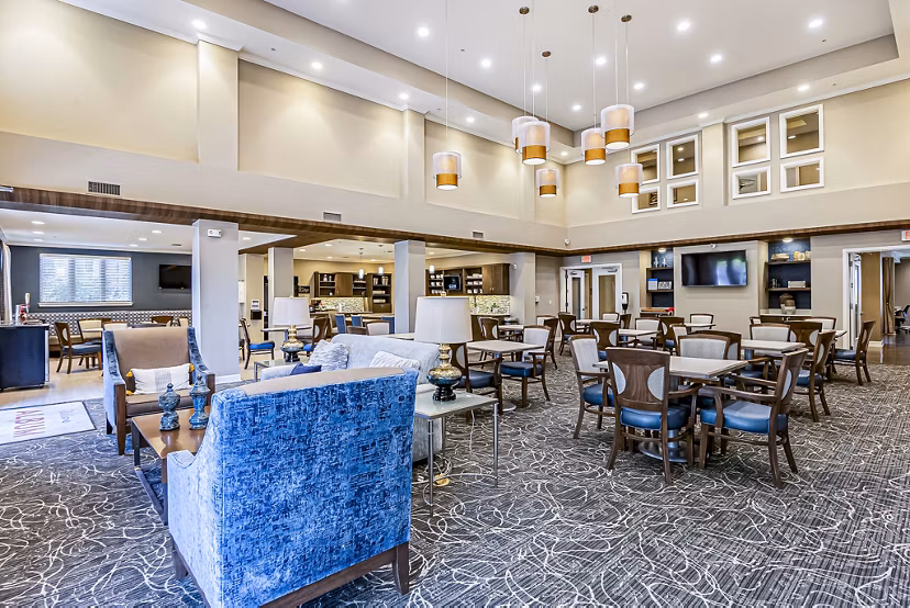 Clubhouse with modern design at Album Quail Springs Apartments, featuring lounge seating and social areas in a luxury setting