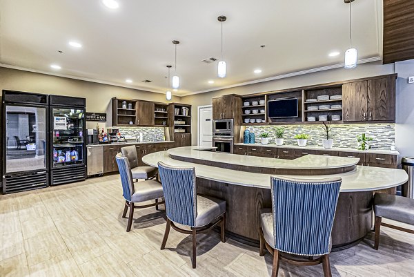 Chic clubhouse kitchen with coffee bar at Album Quail Springs Apartments, ideal for social gatherings and relaxation