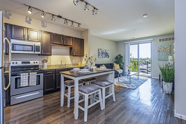 Modern kitchen with stainless steel appliances at Album Quail Springs Apartments