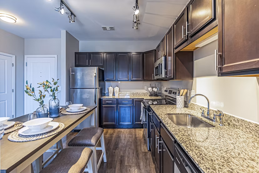 Modern kitchen with stainless steel appliances at Album Quail Springs Apartments