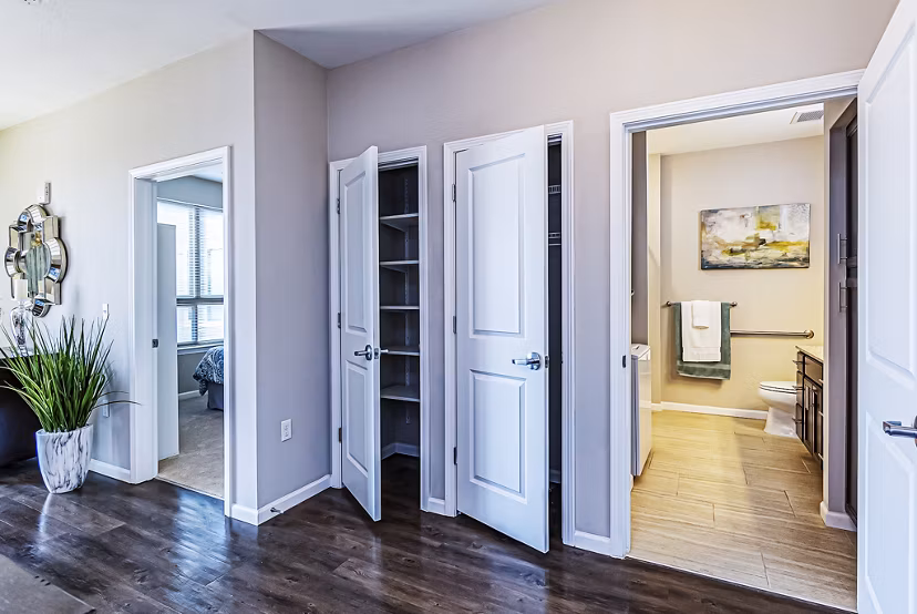 Spacious living room with versatile closet space at Album Quail Springs Apartments