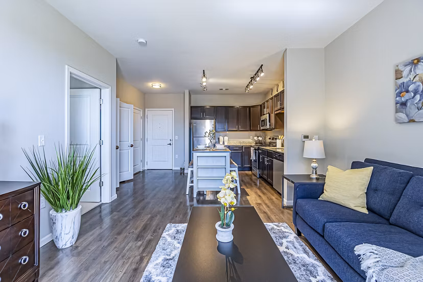 Spacious living room with contemporary design elements in Album Quail Springs Apartments