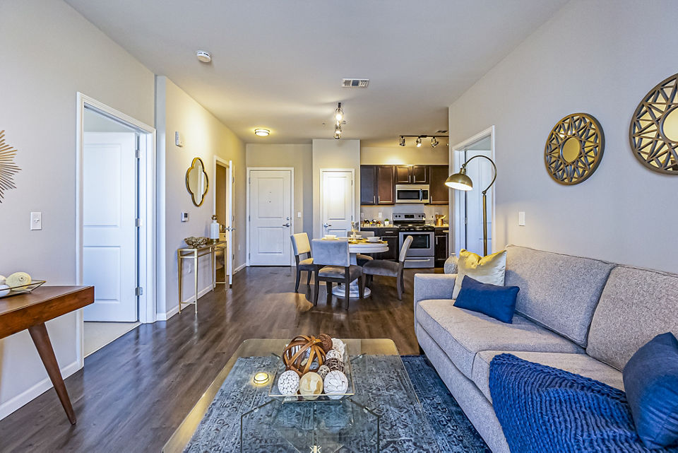 Modern living room with stylish decor and natural light at Album Quail Springs Apartments