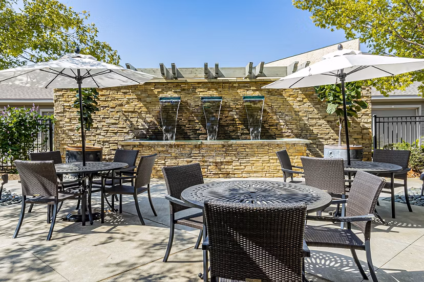 Modern outdoor patio space at Album Quail Springs Apartments with stylish seating and greenery