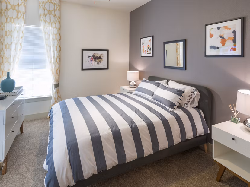 Cozy bedroom with elegant decor at Avana on the Platte Apartments, offering luxury living in Denver