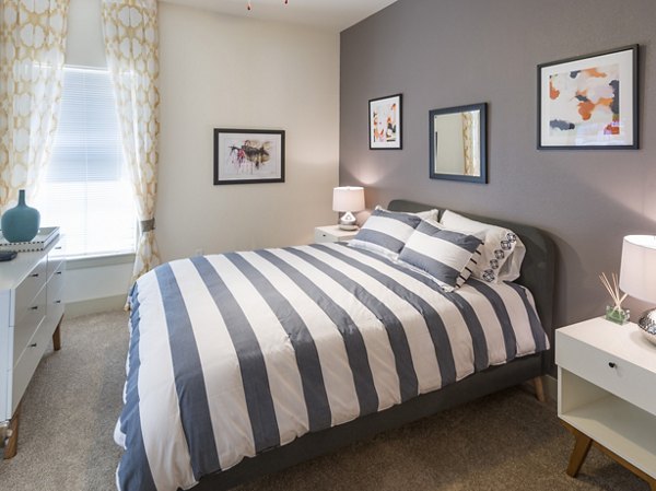 Cozy bedroom with elegant decor at Avana on the Platte Apartments, offering luxury living in Denver