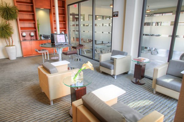 Clubhouse featuring modern design and cozy seating at Avana on the Platte Apartments