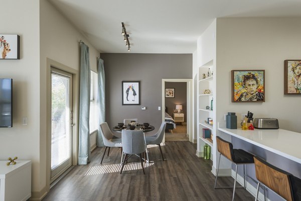 Elegant dining room with sleek furnishings at Avana on the Platte Apartments