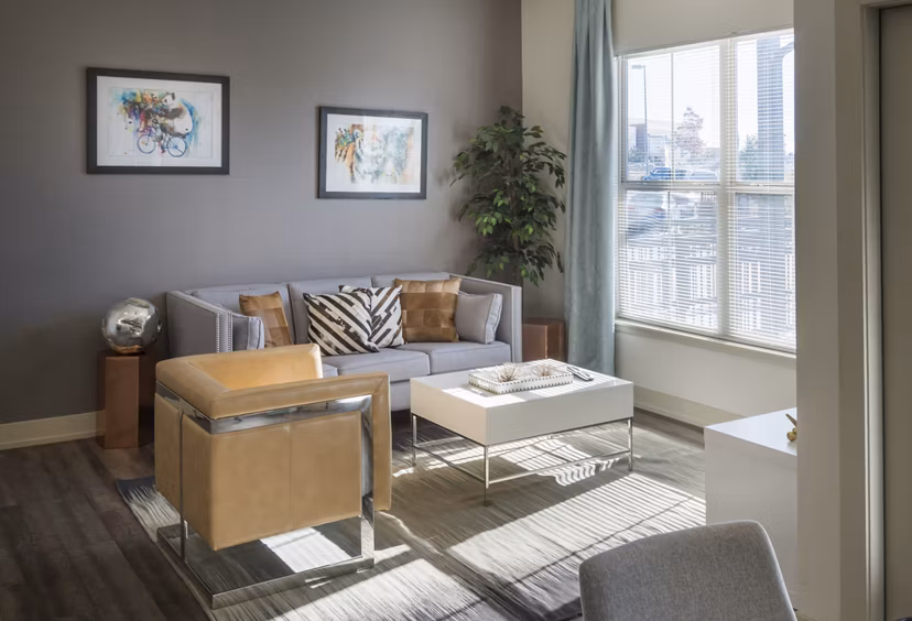Spacious living room with modern furnishings at Avana on the Platte Apartments
