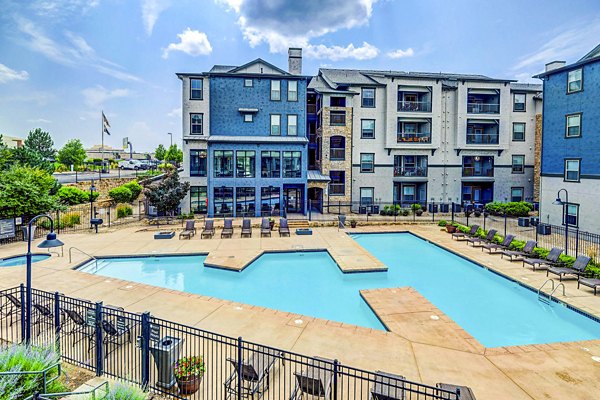 Resort-style pool with loungers at Avana on the Platte Apartments, offering luxury relaxation and recreation options in Denver