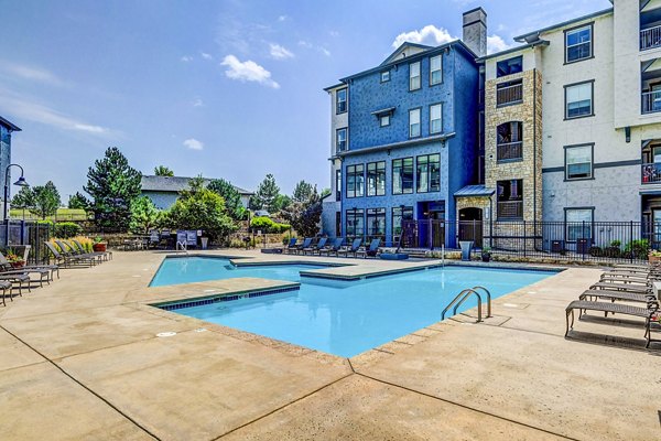 Inviting pool area with lounge seating at Avana on the Platte Apartments
