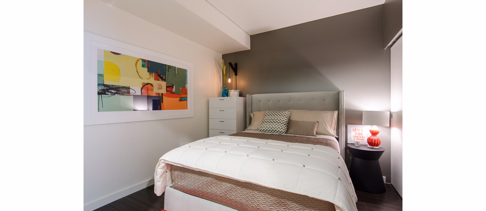Bedroom featuring elegant decor and large windows at Viktoria Apartments in Greystar's luxury collection