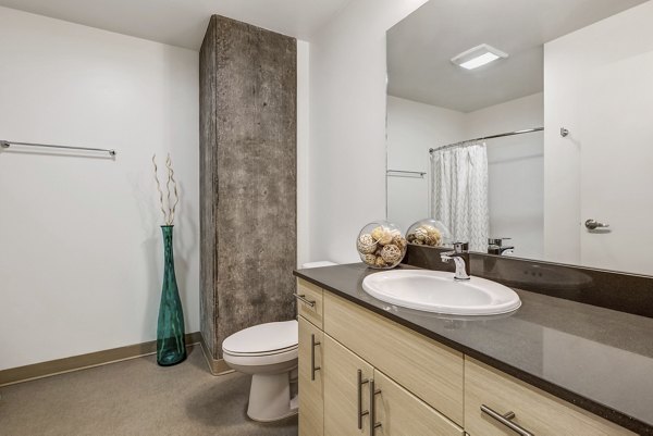 Luxurious bathroom with modern fixtures at Viktoria Apartments in Seattle