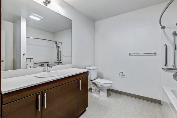 Luxurious bathroom with modern fixtures at Viktoria Apartments, showcasing high-end finishes and elegant design in a Seattle high-rise