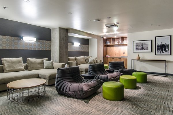Intimate theater room with plush seating at Viktoria Apartments, ideal for movie nights in a luxury setting