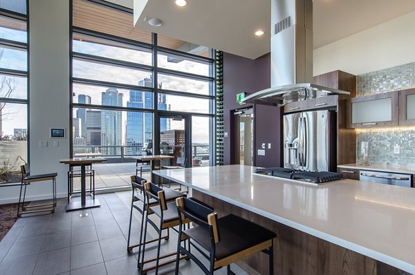 Viktoria Apartments: Modern clubhouse with stylish seating and large TV in luxury community