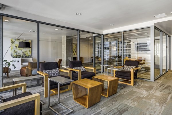 Modern clubhouse with stylish seating and billiard table at Viktoria Apartments