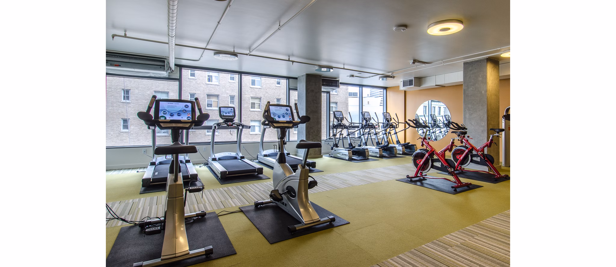 State-of-the-art fitness center with modern equipment at Viktoria Apartments in Seattle, offering a healthy lifestyle for residents