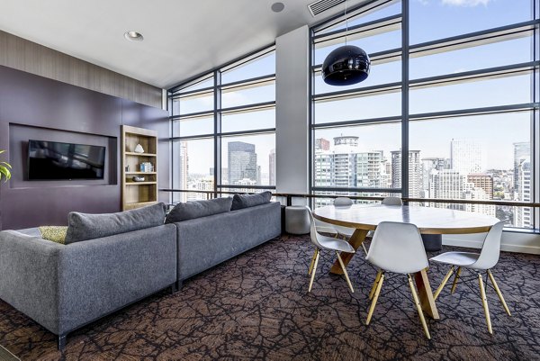 Contemporary living room with modern decor and large windows at Viktoria Apartments