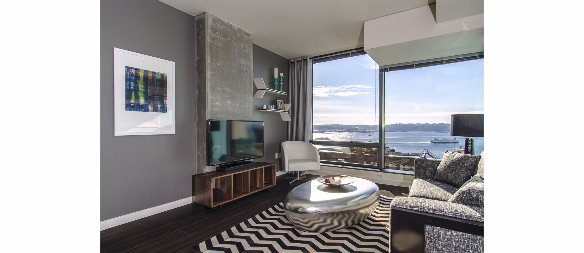 Spacious living room with modern furnishings at Viktoria Apartments in Seattle luxury housing