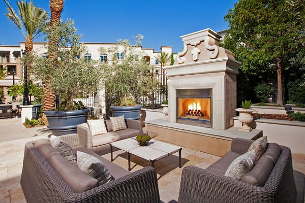 Fire pit with cozy seating at Carlyle Apartments, a Greystar luxury community