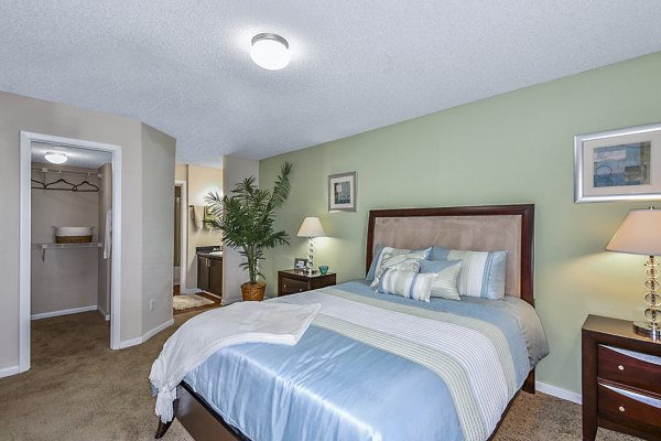 Spacious bedroom with designer finishes at Lakeshore at Altamonte Springs Apartments, offering luxury living for residents