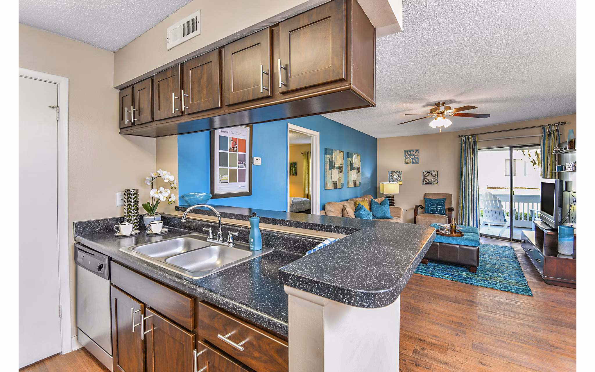 Modern kitchen with stainless steel appliances at Lakeshore at Altamonte Springs Apartments