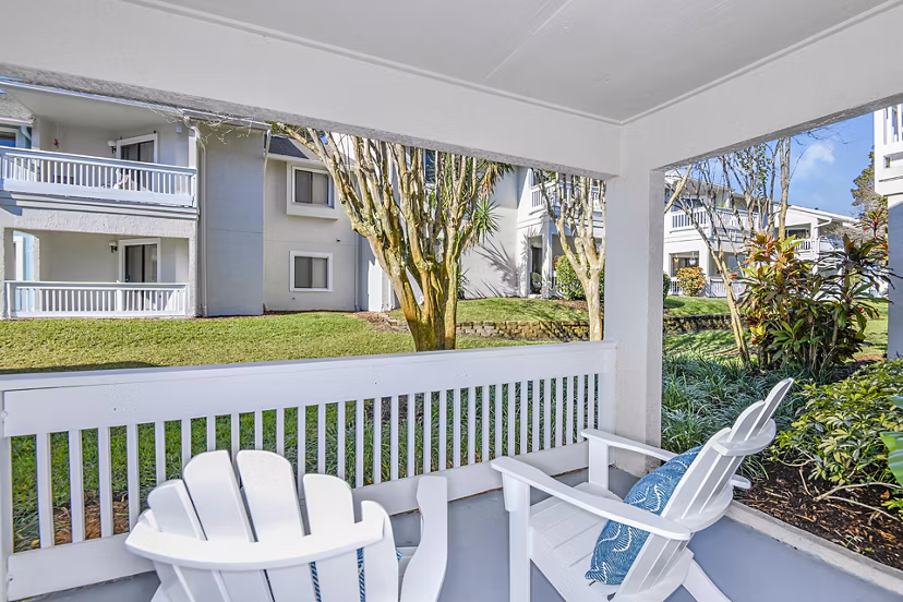 Spacious patio with garden view at Lakeshore at Altamonte Springs Apartments, ideal for relaxation and enjoying nature