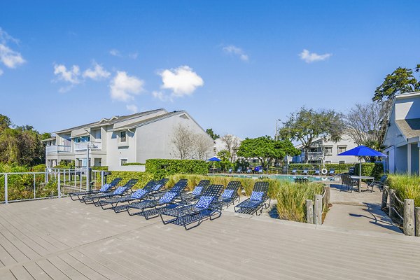 Lakeshore at Altamonte Springs: Modern patio with stylish outdoor seating and garden views at luxury apartments