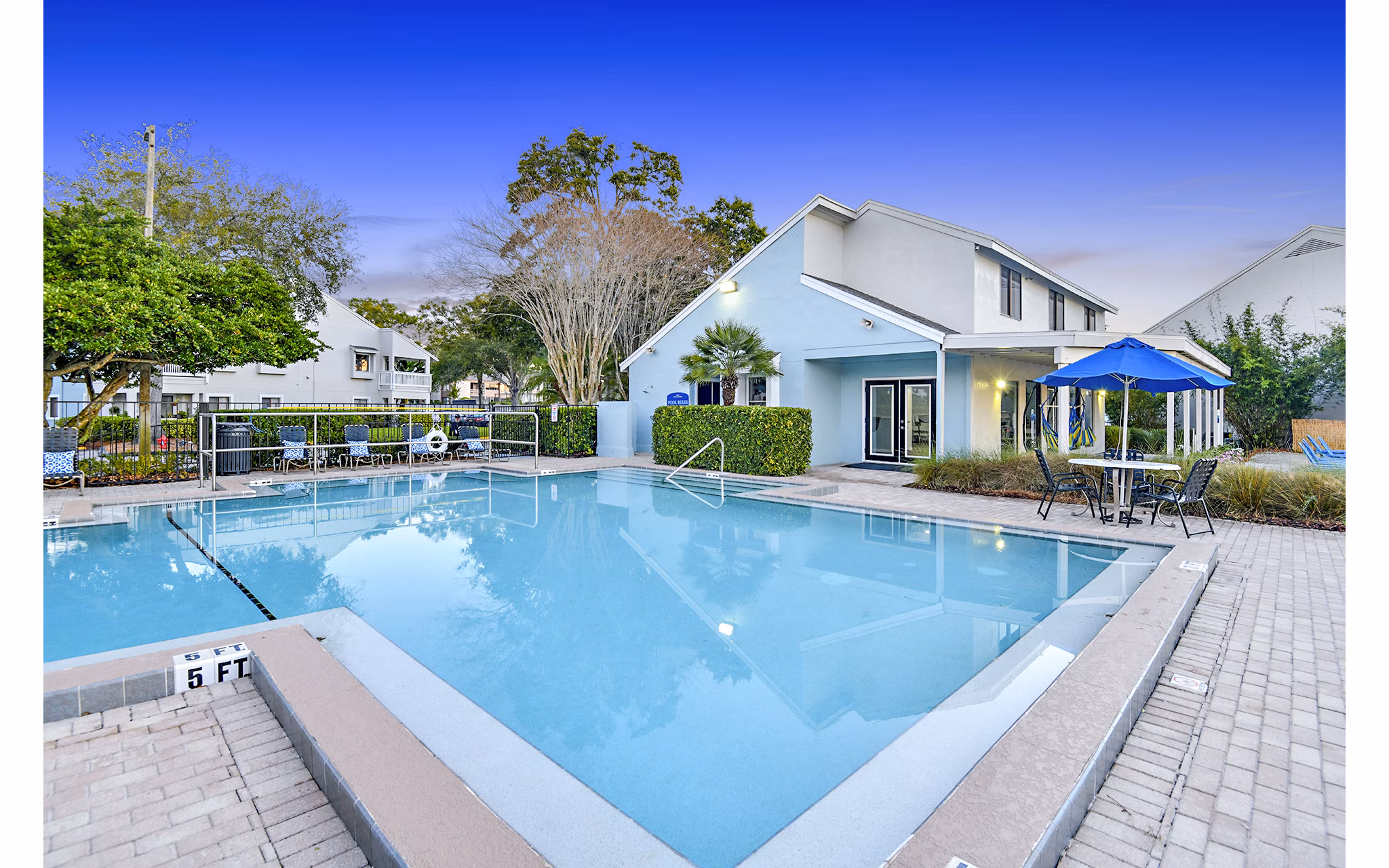 Resort-style pool with lounge chairs at Lakeshore at Altamonte Springs luxury apartments