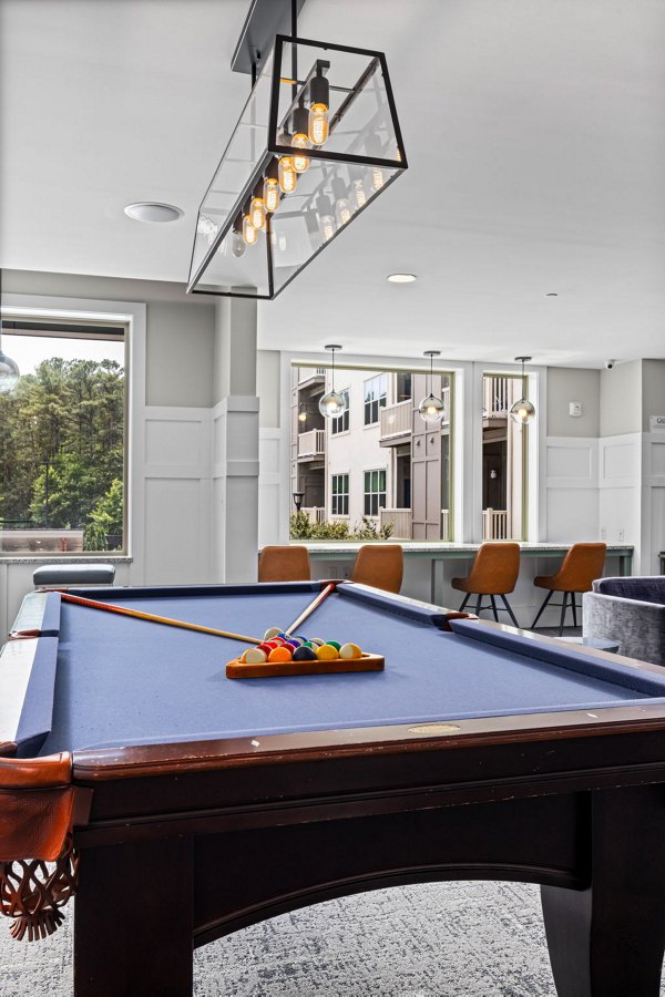 Modern clubhouse with chic decor at Junction Six Forks Apartments, featuring luxury amenities and spaces for social gatherings