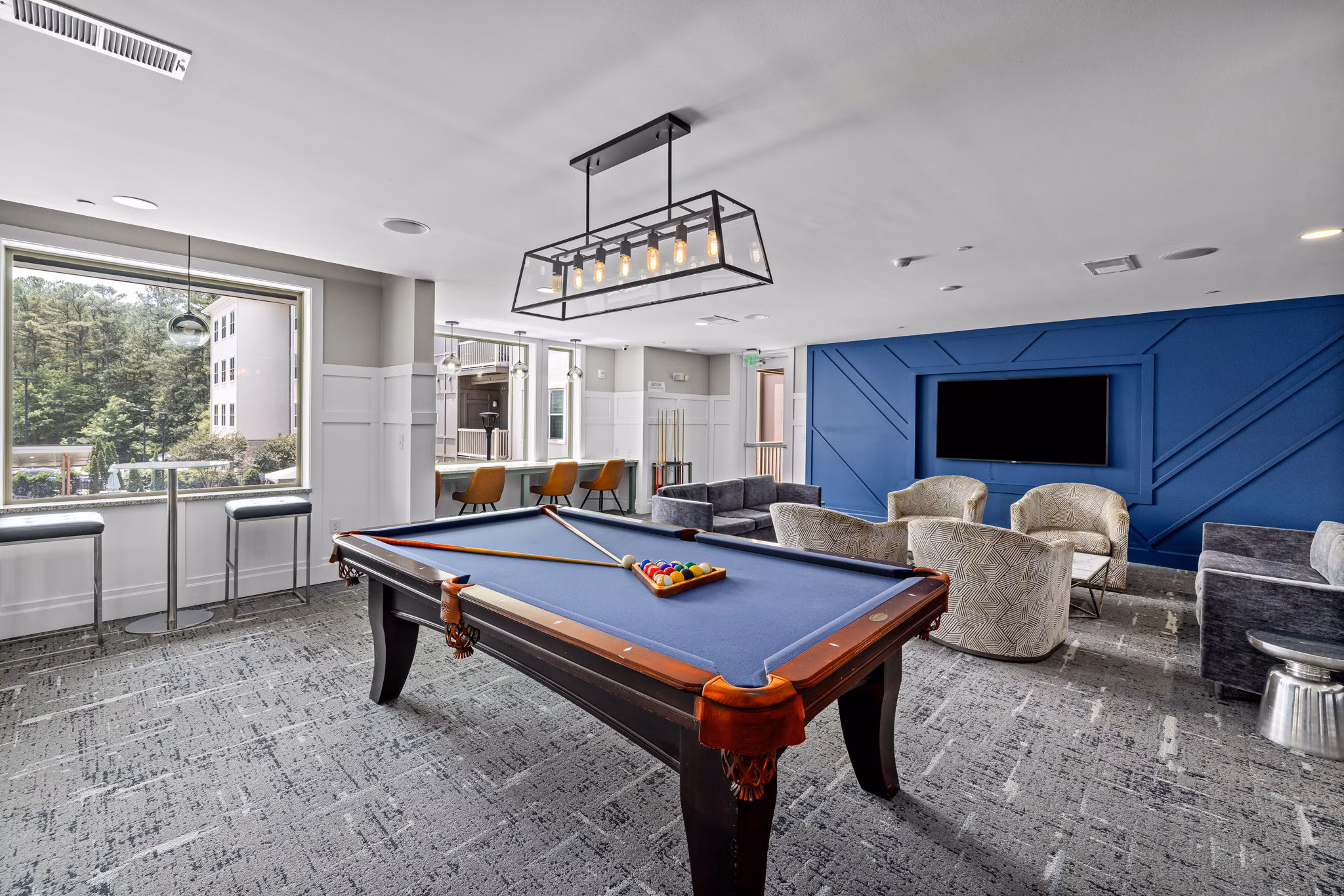 Contemporary clubhouse with modern seating at Junction Six Forks Apartments