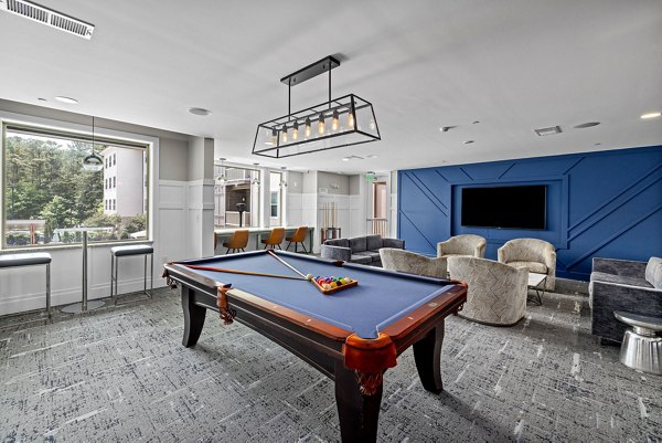 Contemporary clubhouse with modern seating at Junction Six Forks Apartments