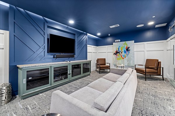 Clubhouse featuring modern lounge areas at Junction Six Forks Apartments