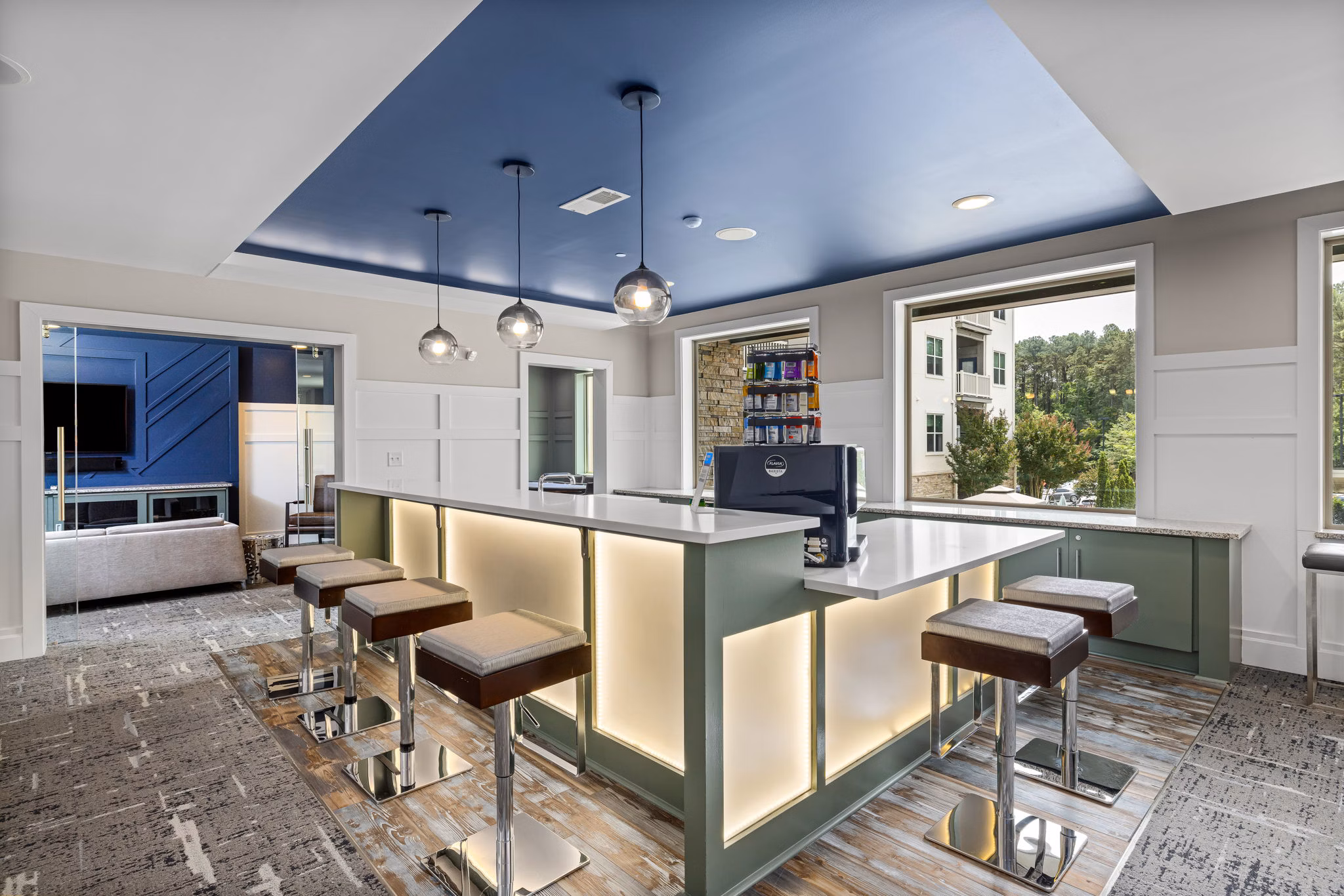 Stylish clubhouse featuring modern seating and billiards at Junction Six Forks Apartments