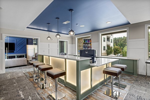 Stylish clubhouse featuring modern seating and billiards at Junction Six Forks Apartments