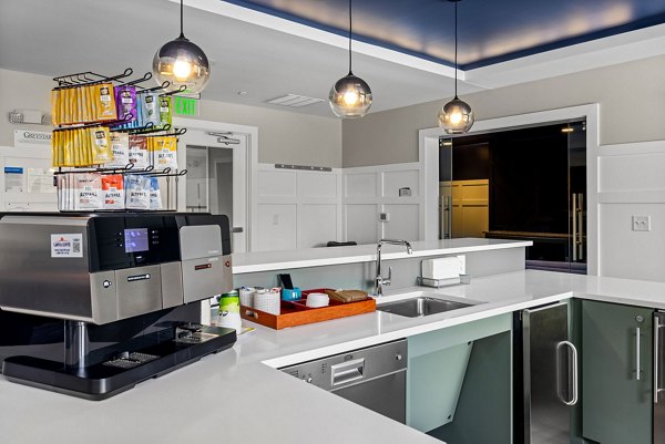 Modern clubhouse with stylish seating and entertainment options at Junction Six Forks Apartments Ideal for socializing and relaxation