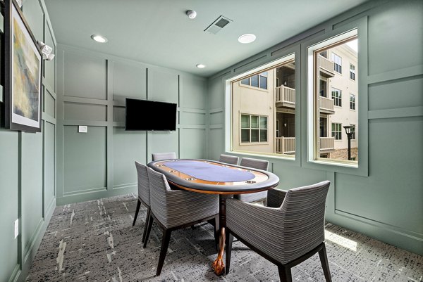 Modern clubhouse with stylish seating and games at Junction Six Forks Apartments