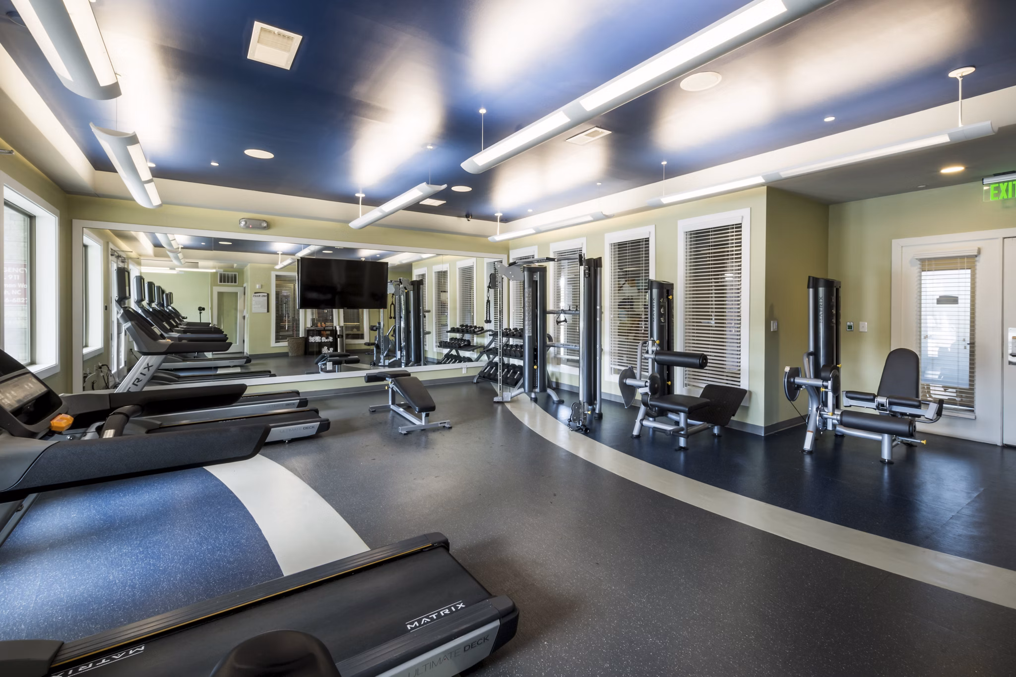 State-of-the-art fitness center with modern equipment at Junction Six Forks Apartments