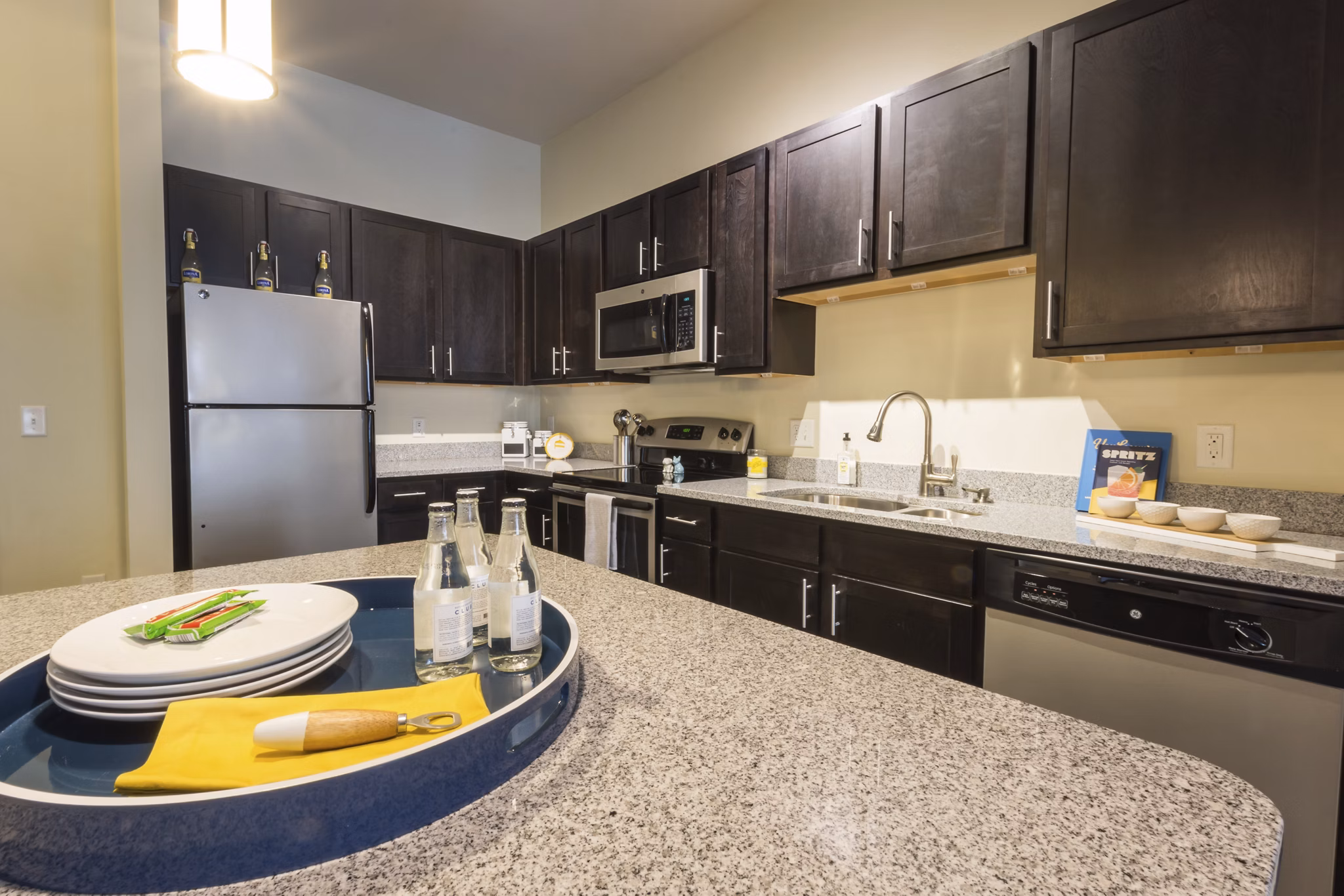 Sleek modern kitchen with stainless steel appliances at Junction Six Forks Apartments