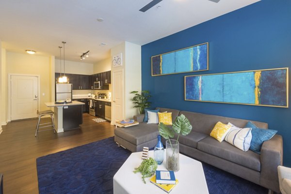 Contemporary living room featuring stylish furniture at Junction Six Forks Apartments in Raleigh