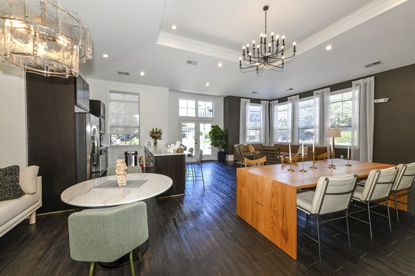 Clubhouse featuring modern lounge seating and entertainment options at Avana Ridenour Apartments
