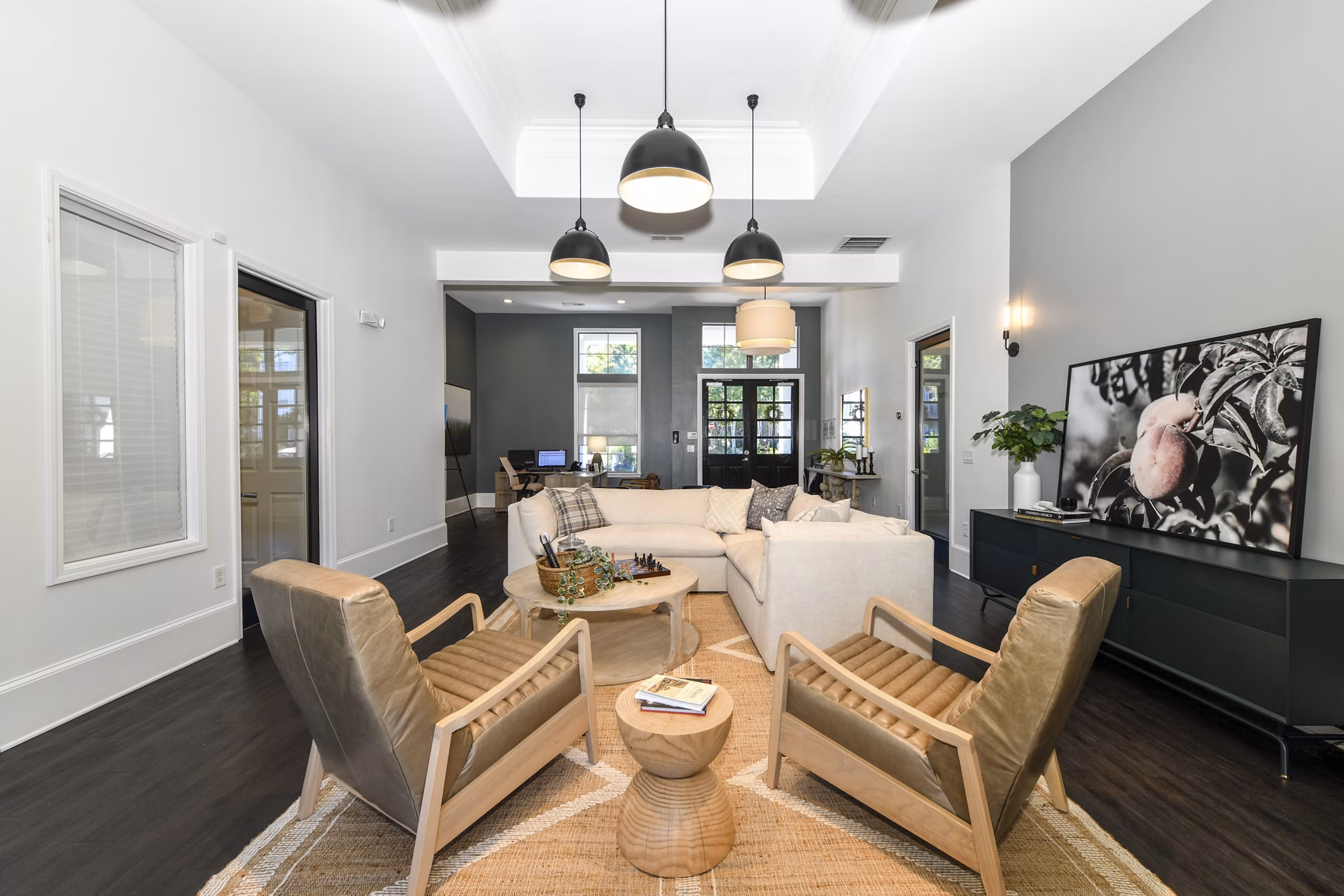 Clubhouse featuring modern furnishings and ample seating at Avana Ridenour Apartments luxury community