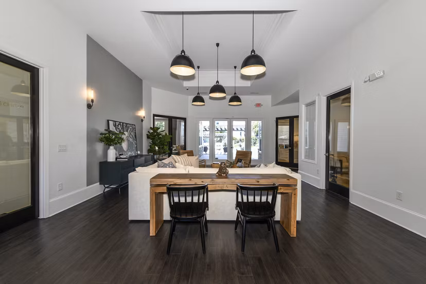 Stylish clubhouse with seating and entertainment options at Avana Ridenour Apartments