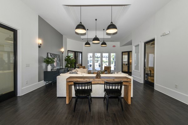 Stylish clubhouse with seating and entertainment options at Avana Ridenour Apartments