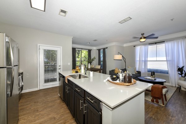 Modern kitchen featuring stainless steel appliances at Avana Ridenour Apartments