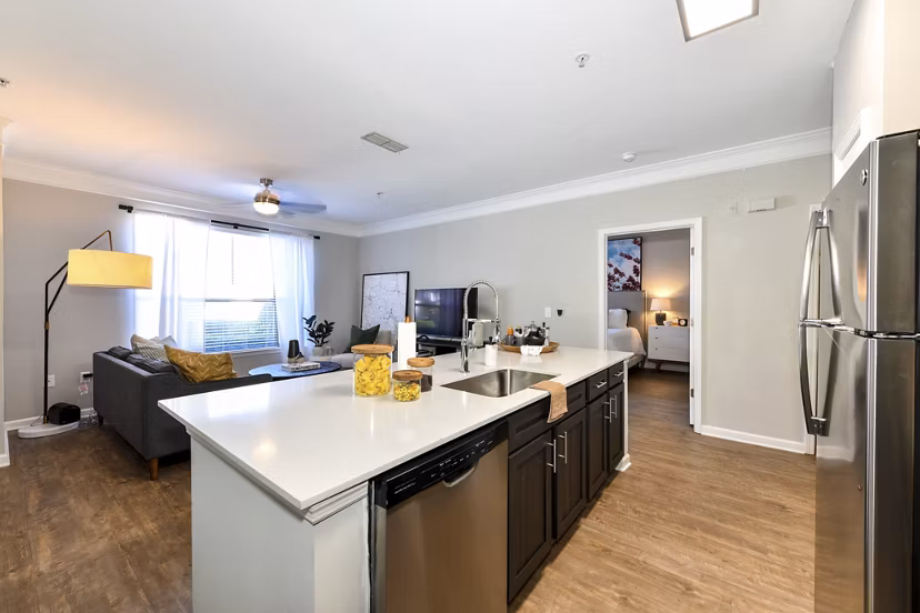 Modern kitchen with stainless steel appliances in Avana Ridenour Apartments, offering luxury living in a stylish setting